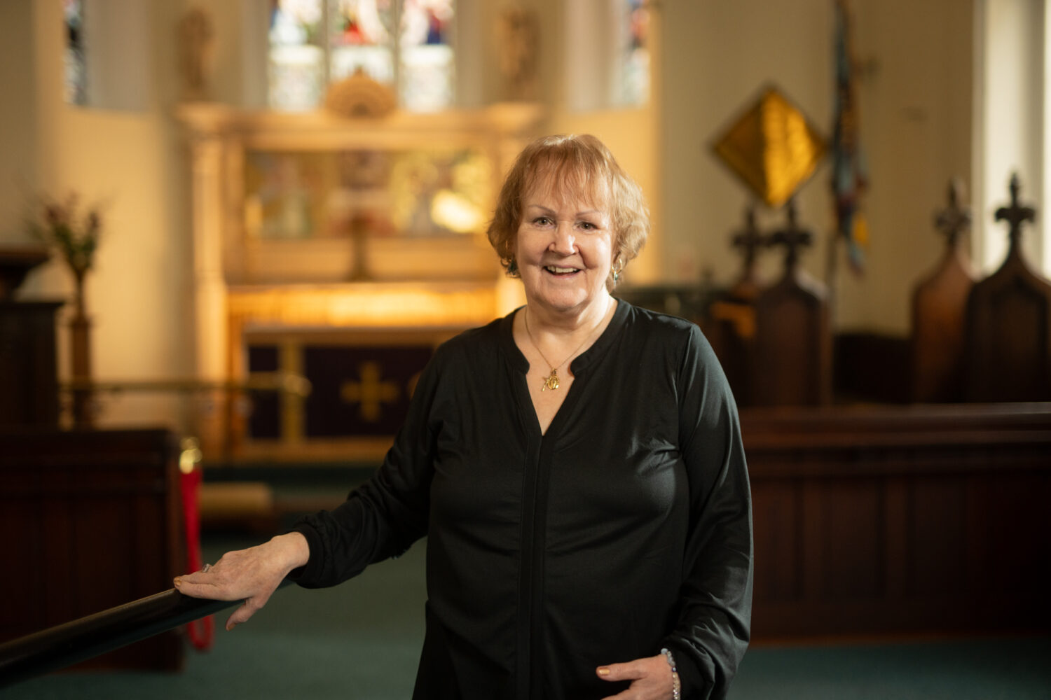 Maureen stands in the chapel